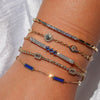 MONISHA MELWANI GOLD DIAMOND MULTI EVIL EYE CHARMS BRACELET